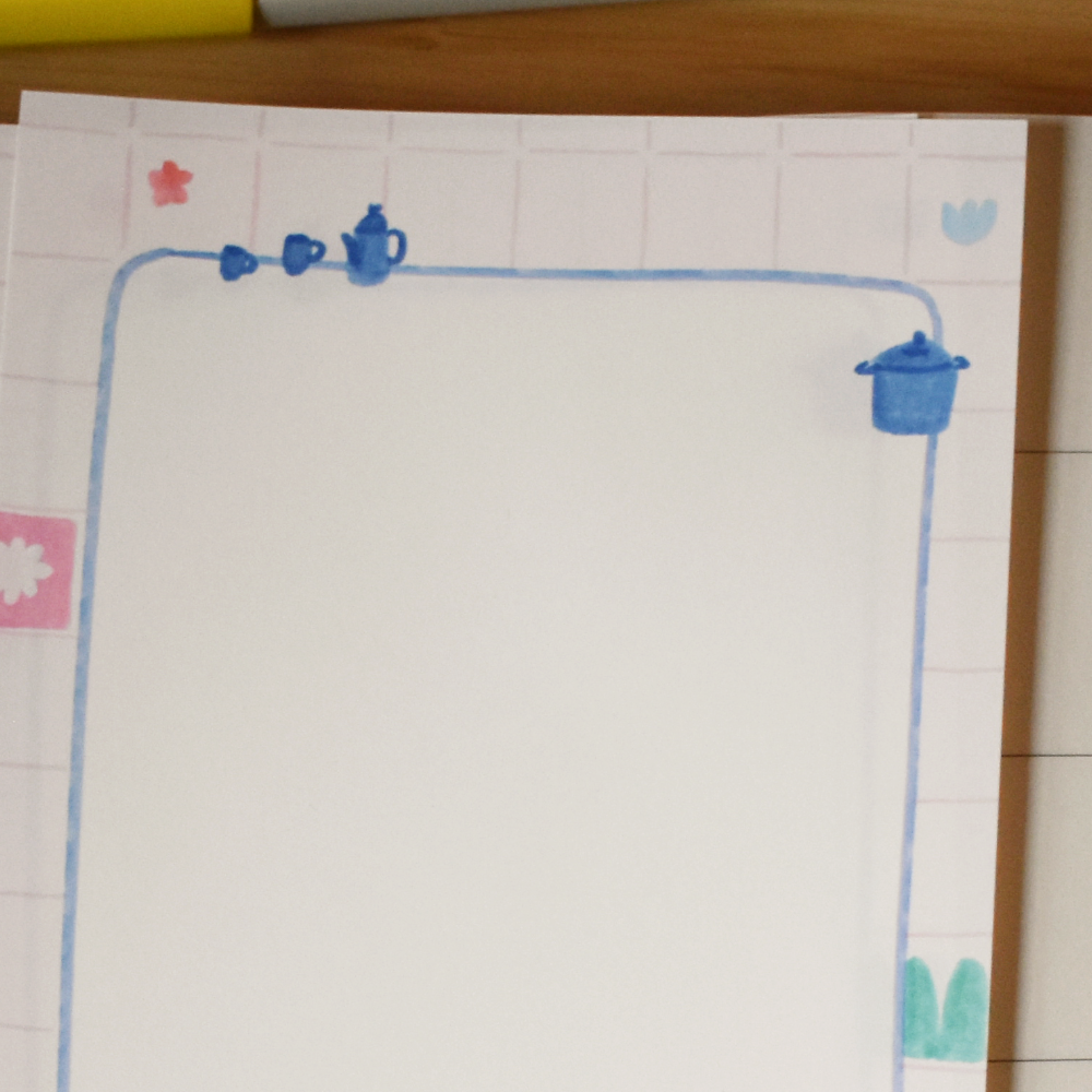 Closeup of stationery featuring kitchen items